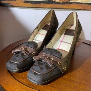 Women’s 9.5 Coach pumps. Classic Coach style with monogrammed design throughout.